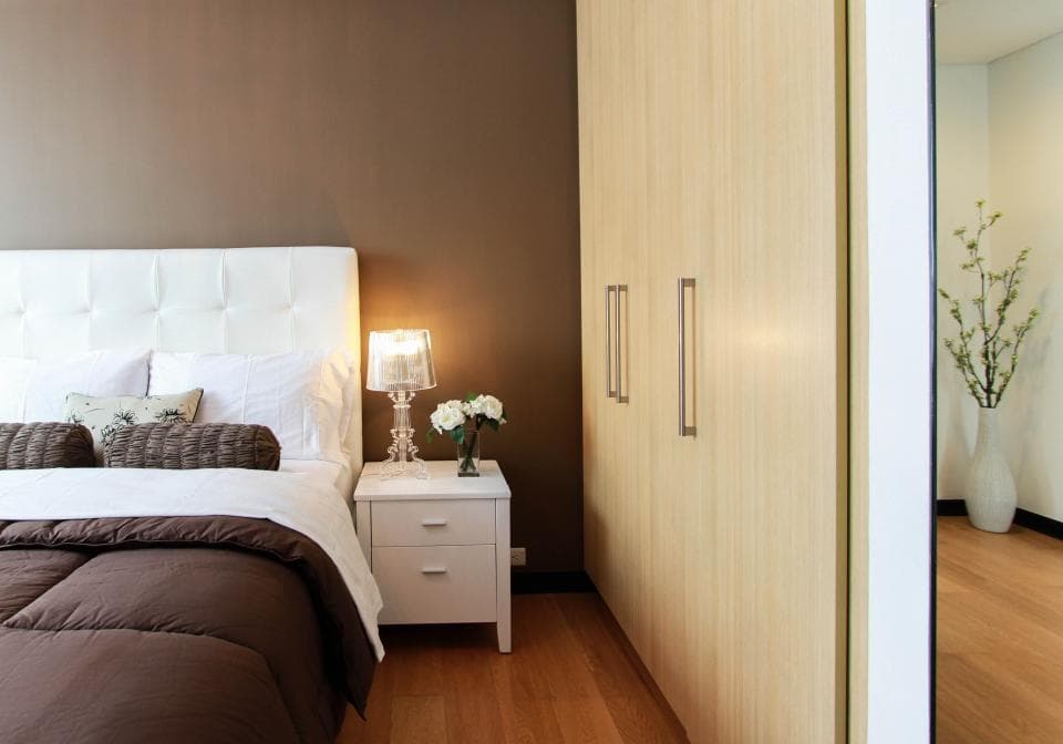 Small bedroom with a double bed and built-in wardrobe